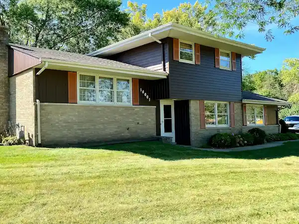 Painting exterior aluminum siding to match old color.